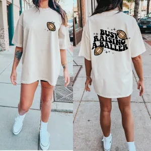 Front/Back Comfort Colors or Bella Canvas Busy Raising A Baller Football Tee/ Football Mom Shirt