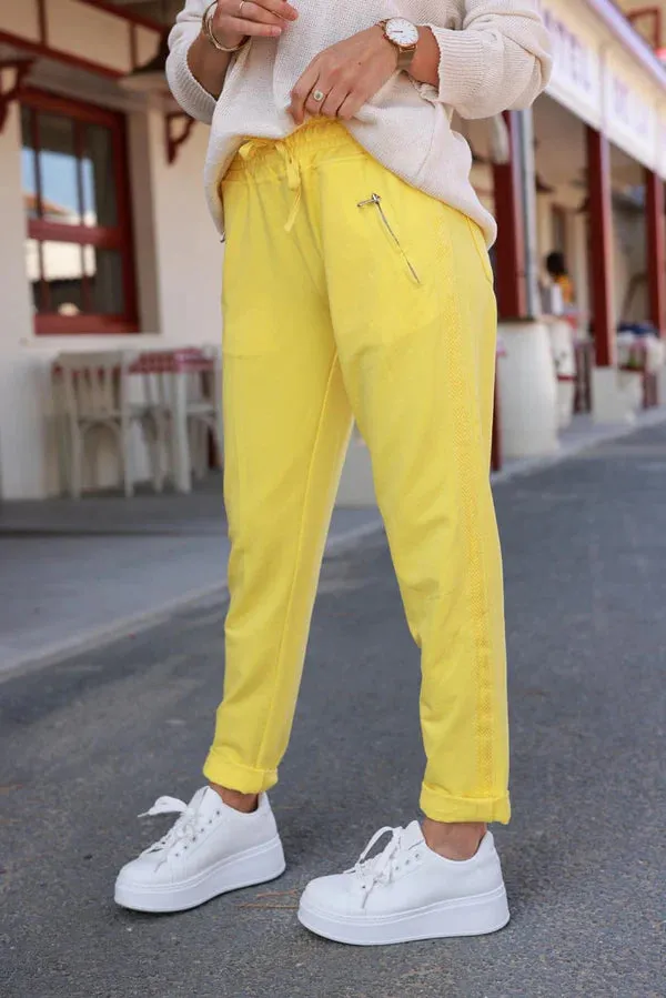 Yellow cotton jogging bottoms with embroidered cheveron outseams