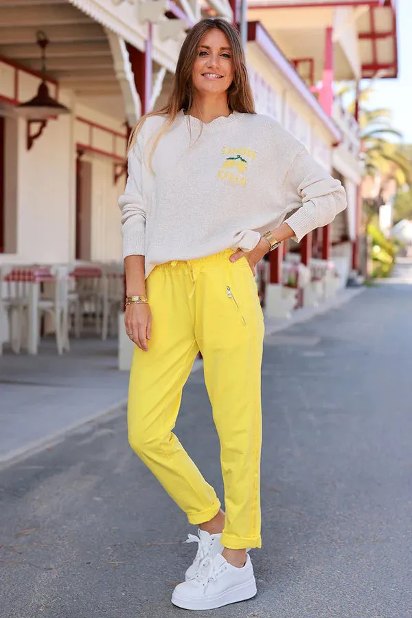 Yellow cotton jogging bottoms with embroidered cheveron outseams