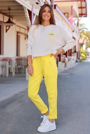 Yellow cotton jogging bottoms with embroidered cheveron outseams